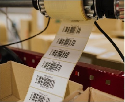 Label printing with barcodes for seamless unit-level traceability