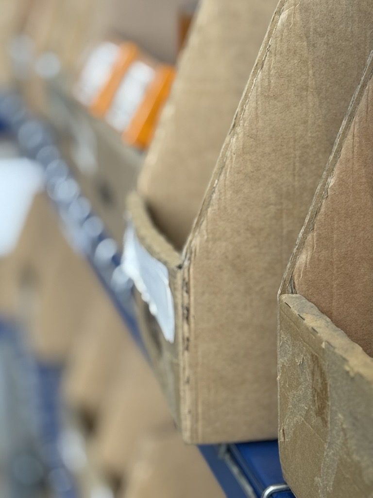 Close-up of pick boxes ready to hand on the shelving