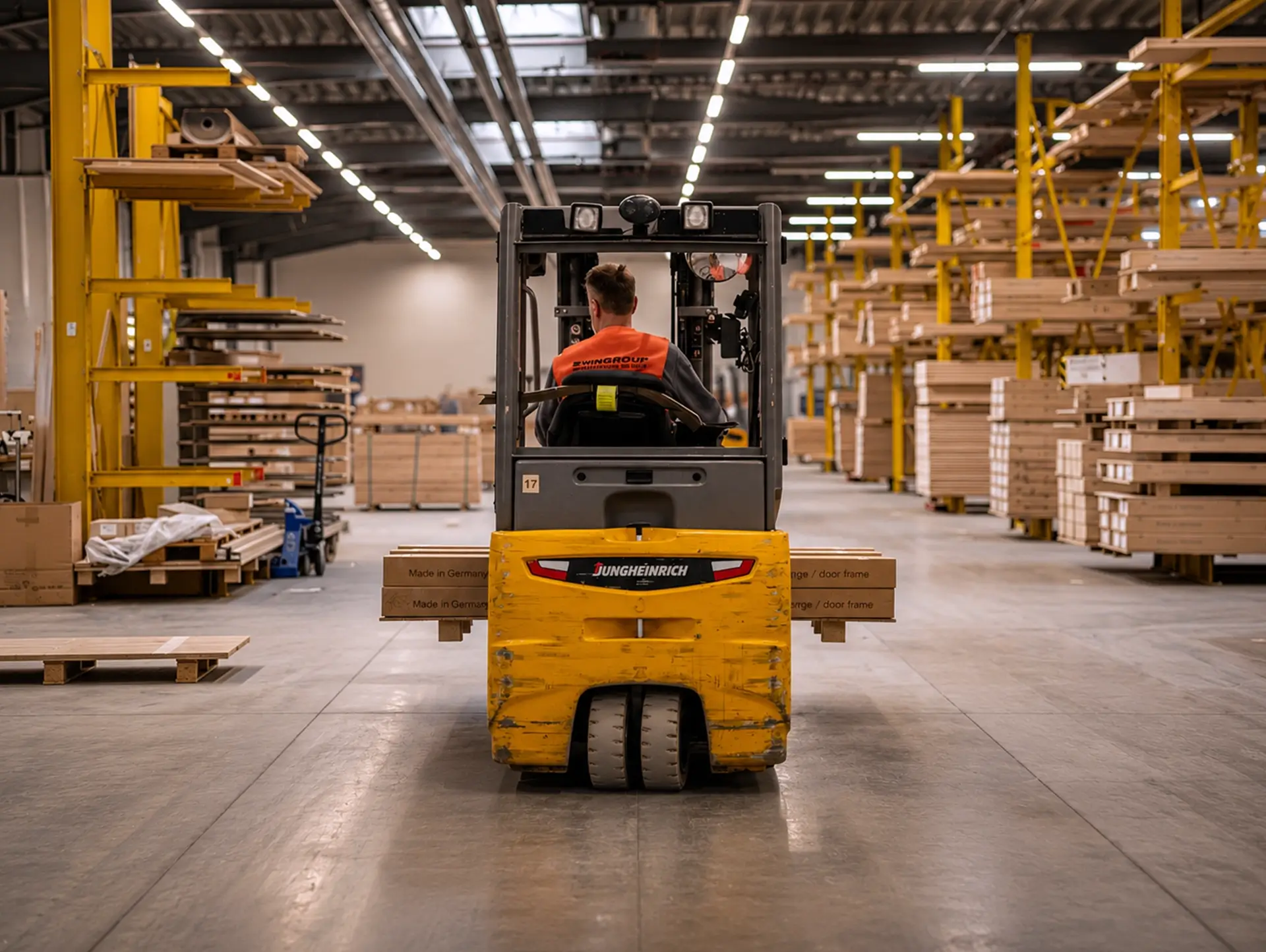 Floor conveyor vehicle for transporting large-format goods in the WM GROUP warehouse in Hamminkeln